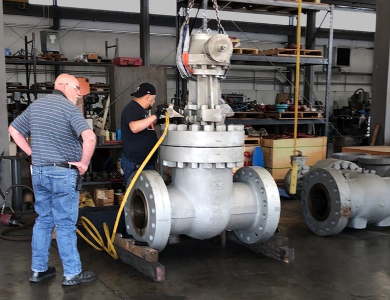 Valve modification of 12-inch 1500 gate valve trim change with precise modifications using a hydraulic torque wrench