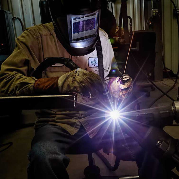 A Kirksey Machine welder expertly works on transition pieces for a custom project. 